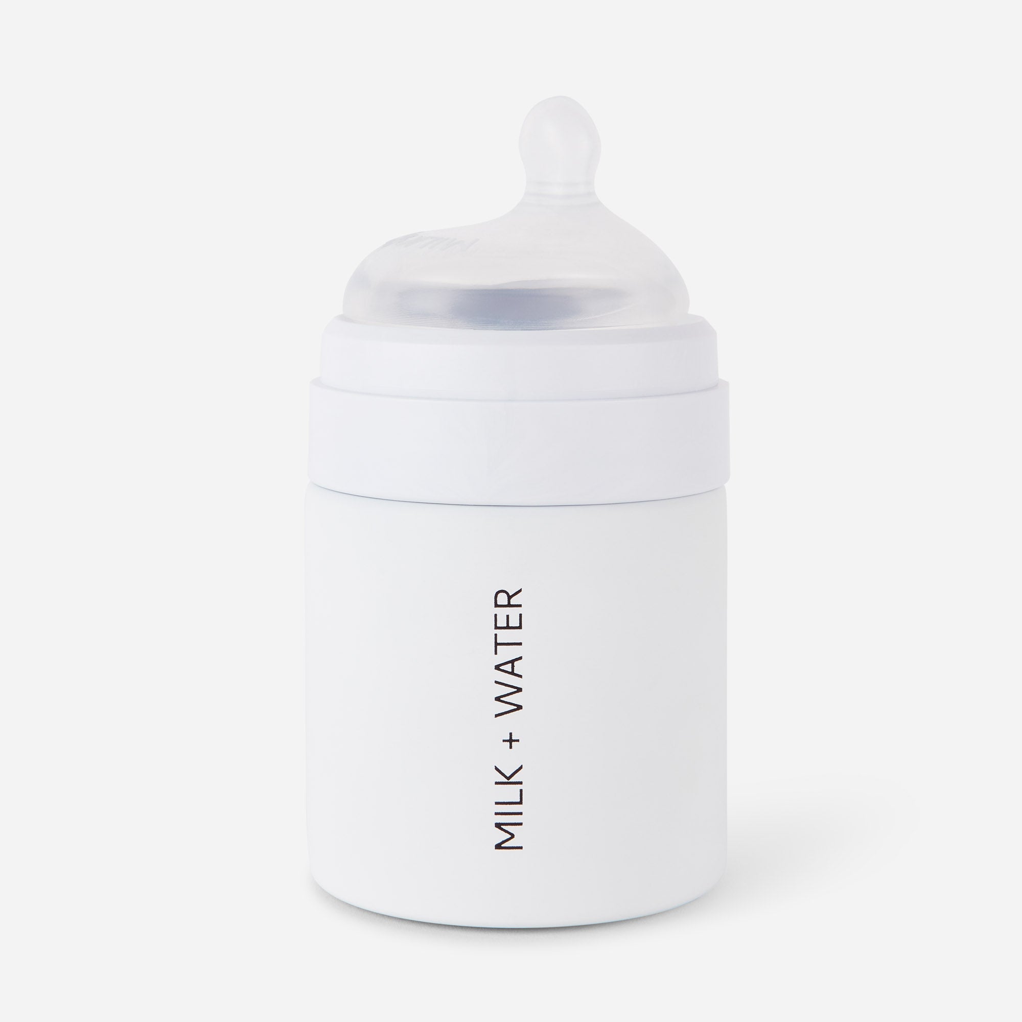 White baby bottle with 'MILK + WATER' label on the side.
